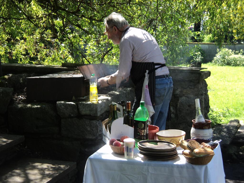 Photo of John Doyle BBQ-ing in the Back Garden