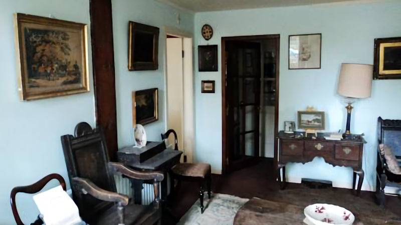 Hallway filled with a number of antiques